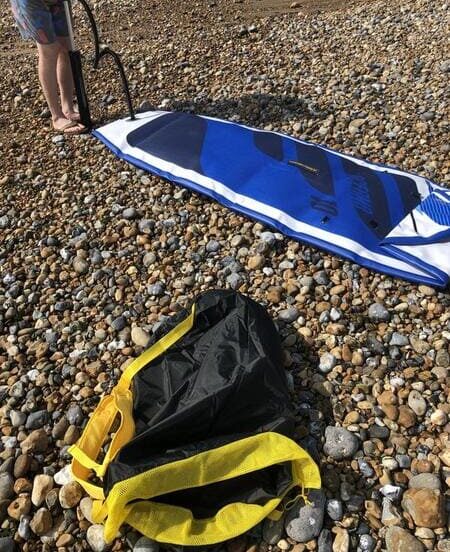 man pumping up hydro force inflatable paddle board