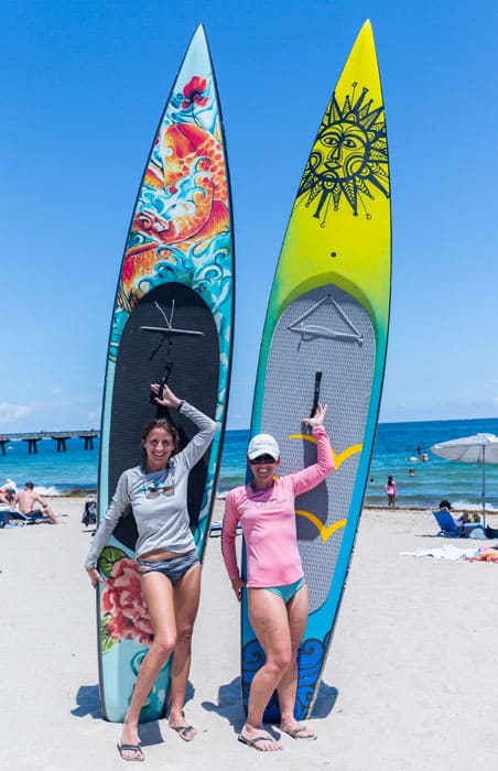 2 girls with custom paddle boards