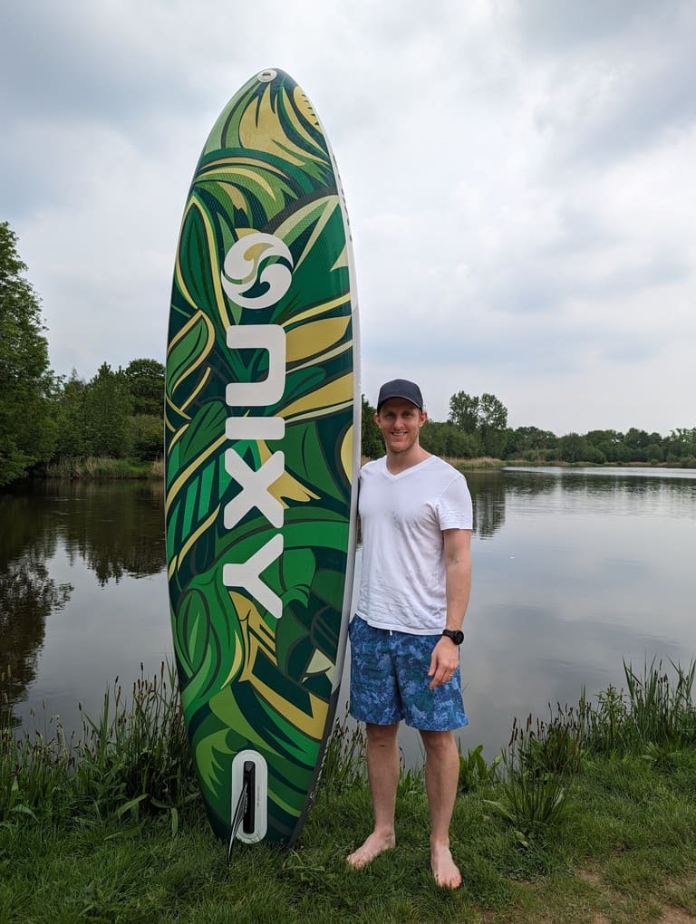 man standing with the new nixy newport g5 sup