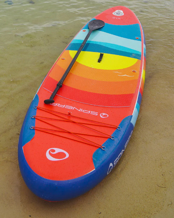 sunset paddle board on the beach