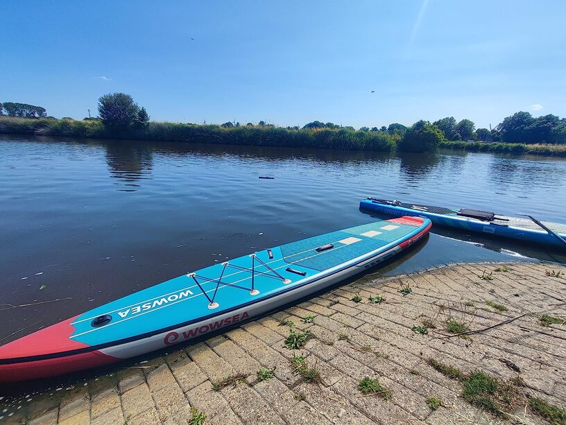 racing paddle board on the water